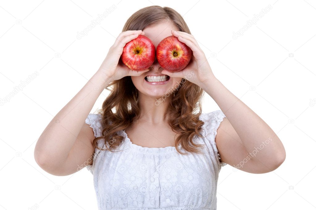 Woman holding two red apples for eyes