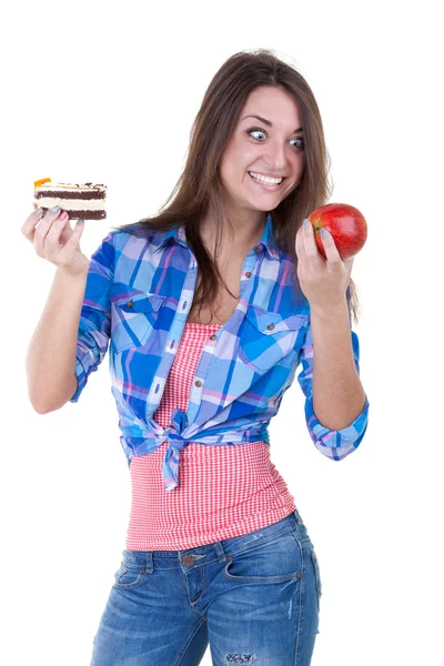 The girl picks an apple or a cake — Stock Photo, Image
