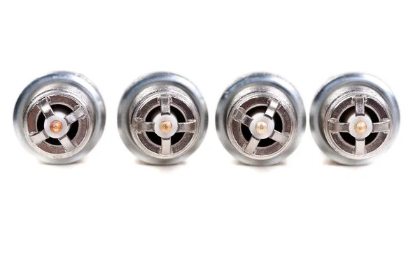 Four automobile spark plugs — Stock Photo, Image