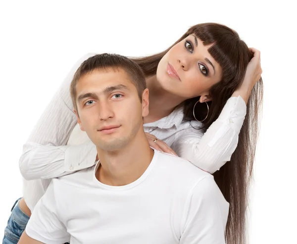Portrait of a beautiful young couple in the studio on a white ba — Stock Photo, Image