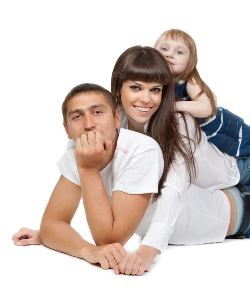 Happy family looking at the camera on their floor — Stockfoto