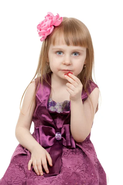 Little beautiful girl eats marmalade — Stock Photo, Image