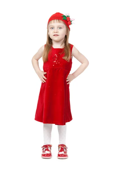 Menina encantadora em boné vermelho e vestido em pleno crescimento — Fotografia de Stock
