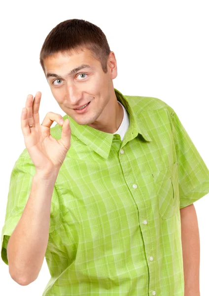 Portrait of a handsome young man showing a sign of Ok, a symbol. — Stock Photo, Image