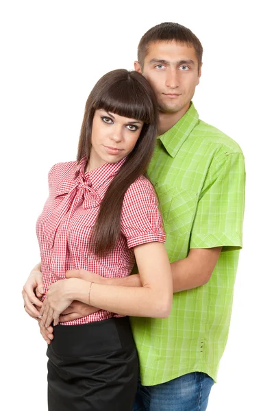 A man embraces a girl in the studio. Isolate on white — Stock Photo, Image