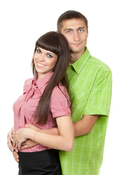 Beautiful couple in colored clothing. Studio portrait, isolate o — Stock Photo, Image