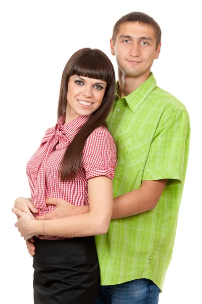 家庭画像中，夫妇在一张白纸的颜色衣服的爱 — 图库照片