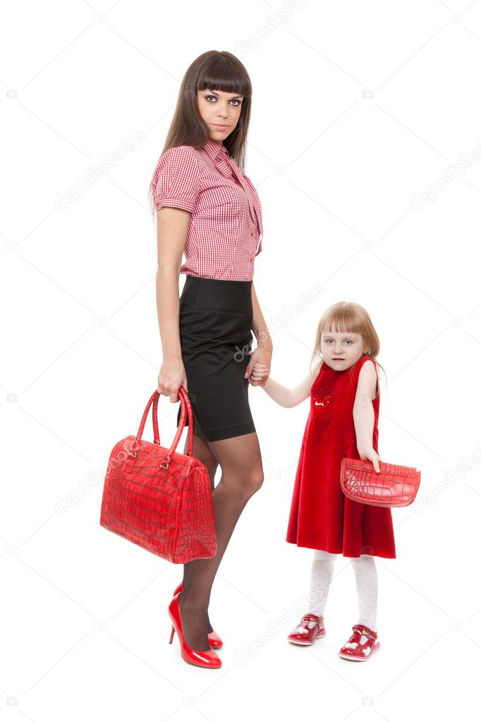 Fashionable Mom in red shoes and her little daughter with a beau
