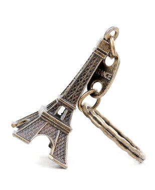 Small bronze copy of Eiffel tower figurine isolated on white bac clipart