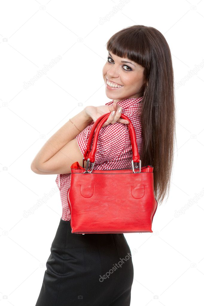 Portrait of a girl with a fashionable red handbag