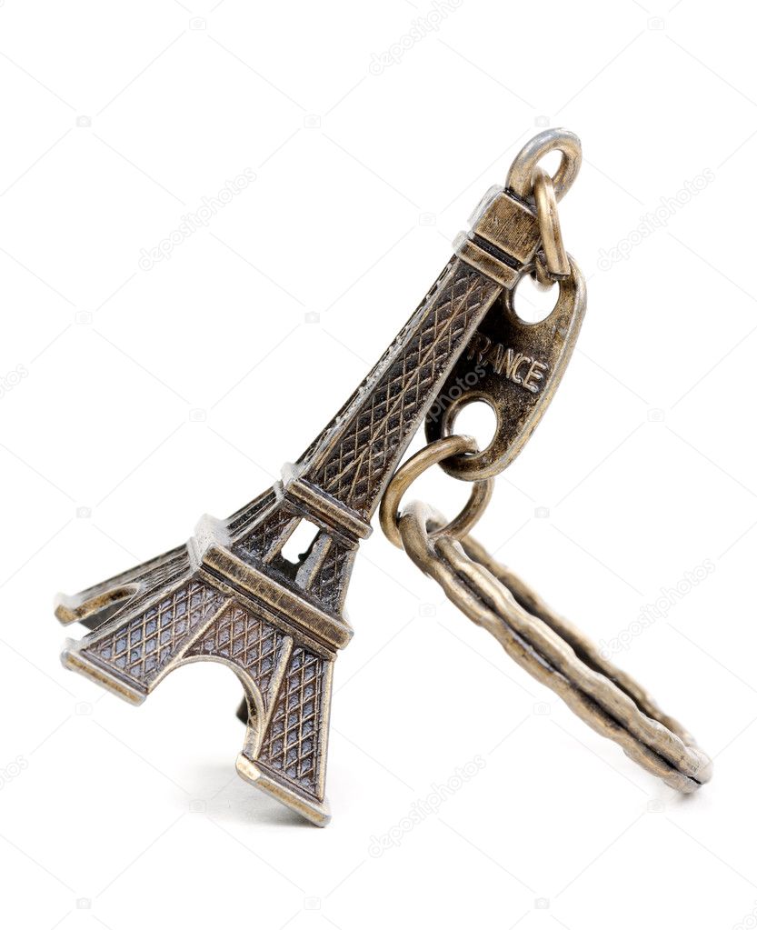 Small bronze copy of Eiffel tower figurine isolated on white bac