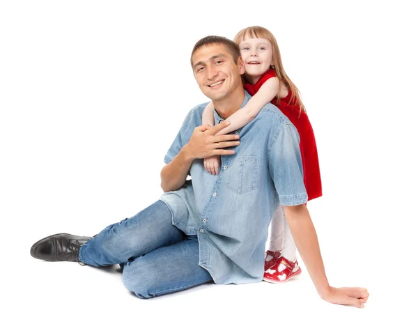 Sorrindo pai e filha sentados no chão — Fotografia de Stock