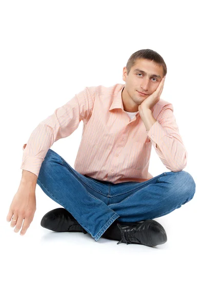 Молодий чоловік сидить у позі лотоса — стокове фото