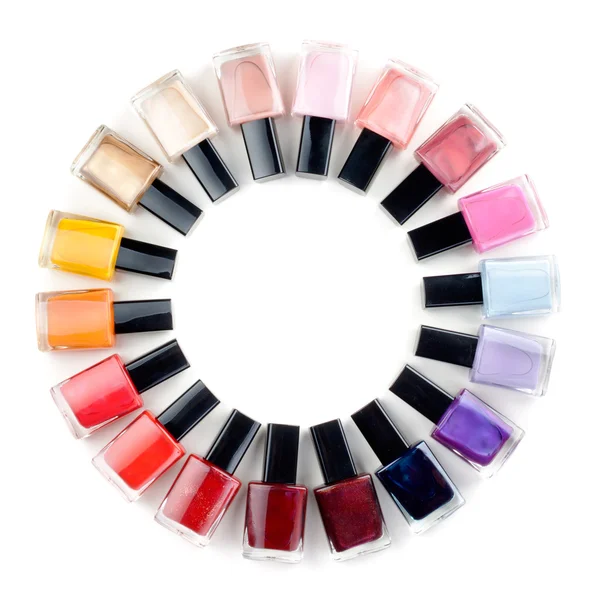 Gekleurde nagellak flessen gestapelde cirkel Stockfoto