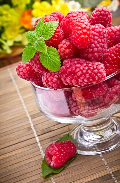 Sweet fresh raspberry fruits in glass goblet — Stock Photo, Image