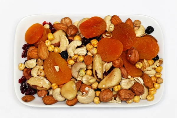 Fruits and nuts plate — Stock Photo, Image