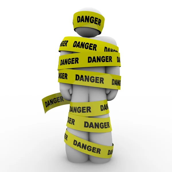 Osoba v žluté nebezpečí pásky výstražné upozornění — Stock fotografie