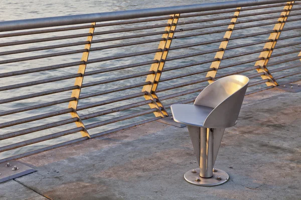 Metal chair at waterfornt — Stock Photo, Image
