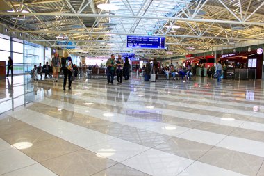 are waiting for a flight in terminal F in Boryspil, Kiev clipart