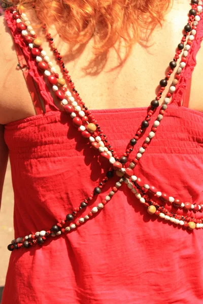 Women's beads on the red background — Stock Photo, Image