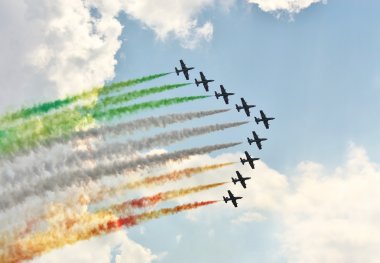 Demonstrative performance of Italian aerobatic team at the air s clipart