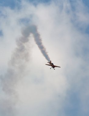 Plane of the aerobatic group “First flight” in the sky clipart