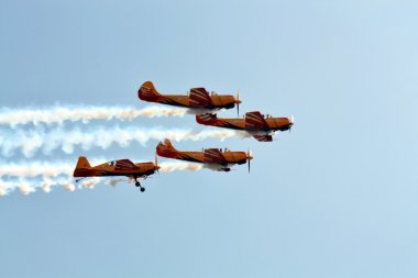 Aerobatic group “First flight” in the sky clipart