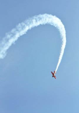 Perform aerobatics by the aircraft at the airshow clipart