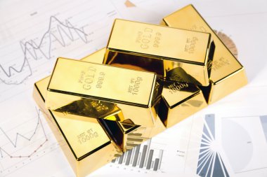 Gold bars on graphs and statistics clipart