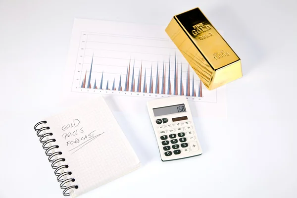 Gouden staven op grafieken en statistieken — Stockfoto