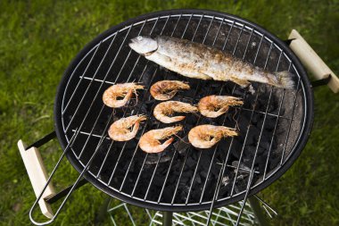 Seafood on grill! clipart