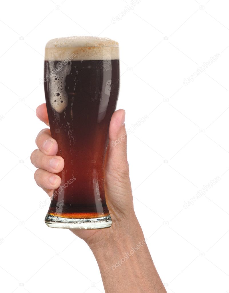 Hand Holding Glass of Foamy Beer