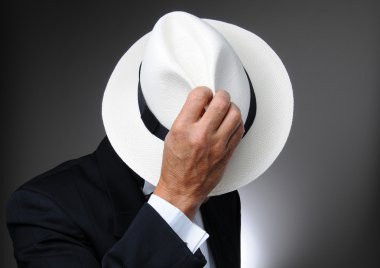 Man in Tuxedo Behind Hat. clipart