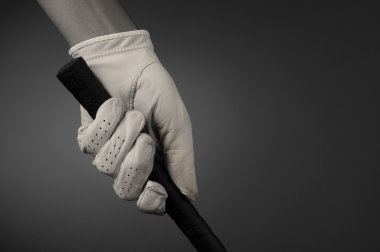 Closeup of a Golfers Gloved Hand on Club clipart