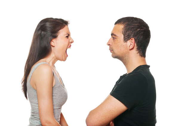 Unhappy young couple having an argument. Isolated on white.