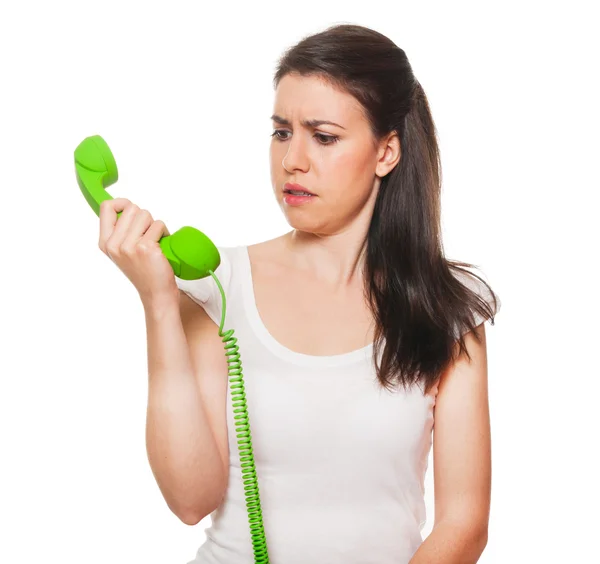 Junge Frau, die von jemandem am Telefon gestresst wird — Stockfoto