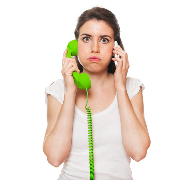 Young female getting stressed by someone on the phone.