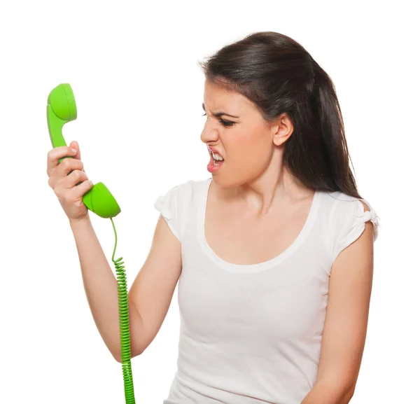 Jovem do sexo feminino ficar estressado por alguém ao telefone . — Fotografia de Stock