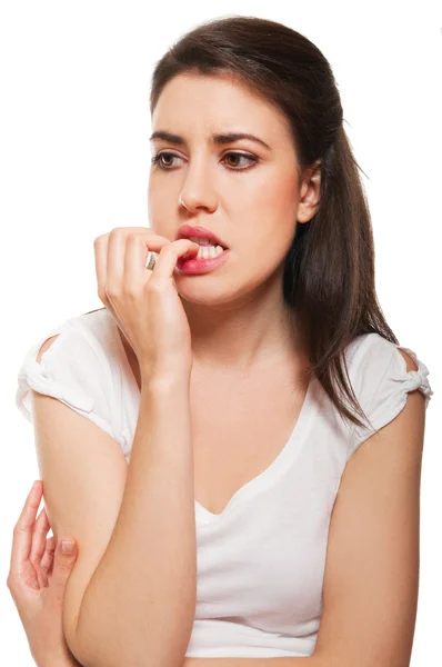 Young female biting her nails — Stock Photo, Image
