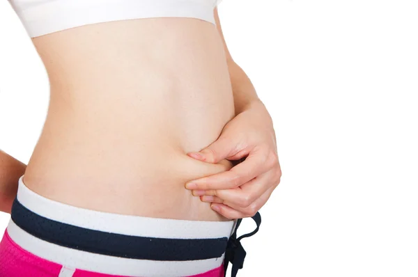 Giovane adulto controllando il suo grasso ventre — Foto Stock