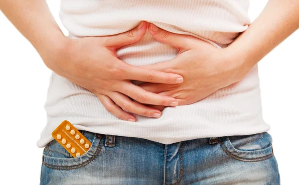 Woman holding birth control pills Stock Picture