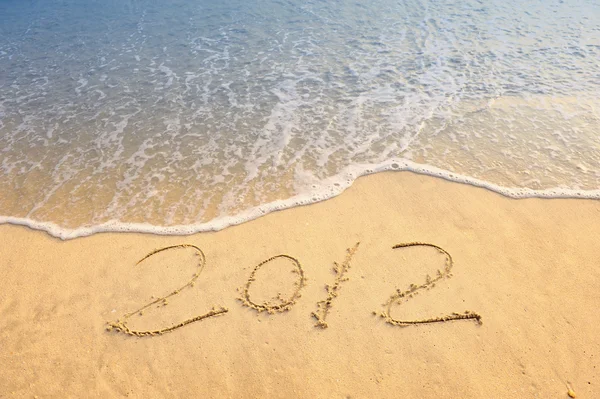 2012 mensaje de año nuevo en la playa de arena — Foto de Stock
