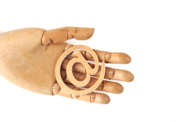 Wooden mannequin hands, holding email symbols — Stock Photo, Image