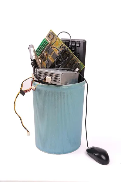 Different computer parts and phone in trash can — Stock Photo, Image