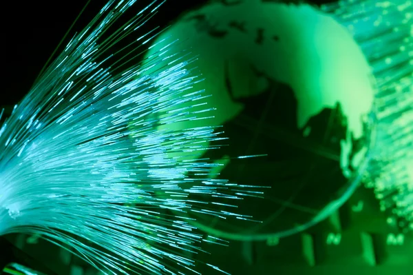 Conceito de dados de computador com globo terrestre contra fundo de fibra óptica — Fotografia de Stock