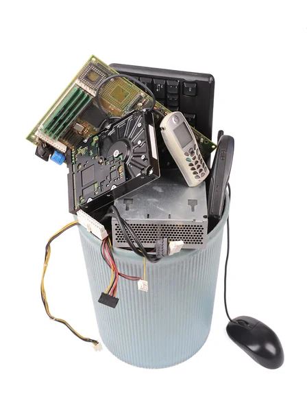 Different computer parts and phone in trash can — Stock Photo, Image
