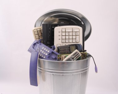 Different computer parts and phone in trash can clipart