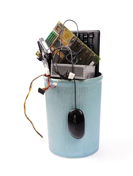 stock image Different computer parts and phone in trash can