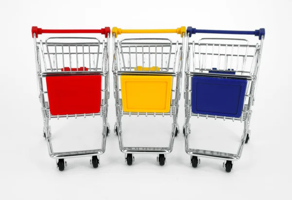 Gift box with shopping carts over white background — Stock Photo, Image