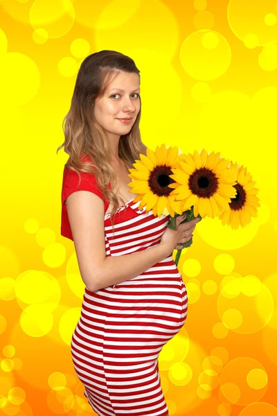 The pregnant woman and sunflower — Stock Photo, Image